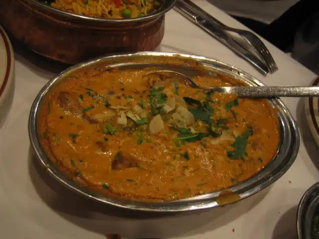 Gosht Pasinde in a plate with spoon